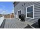 Spacious back deck area with gray flooring and open outdoor space at 7131 Shavano Cir, Frederick, CO 80504