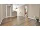 Open living room featuring hardwood floors, staircase, and neutral wall colors at 7131 Shavano Cir, Frederick, CO 80504