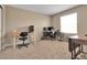 Home office space with multiple desks, monitors, and plenty of natural light at 7131 Shavano Cir, Frederick, CO 80504