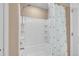 Clean bathroom shower with white tiled walls and adjustable shower head at 7131 Shavano Cir, Frederick, CO 80504