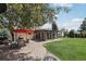 Spacious backyard with patio, grill, and sunroom addition to the house at 1164 W 101St Pl, Northglenn, CO 80260