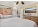 Bedroom with a ceiling fan, television, dresser, and mirrored closet at 1164 W 101St Pl, Northglenn, CO 80260
