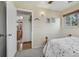Bedroom with a ceiling fan, hardwood floor entry, and neutral walls at 1164 W 101St Pl, Northglenn, CO 80260