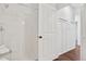 Bright bathroom features white tiled shower and wainscoting in the hallway at 4085 S Crystal Cir # 101, Aurora, CO 80014
