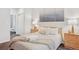 A well-lit bedroom offers soft natural light, a calming color palette and plush decor at 4085 S Crystal Cir # 101, Aurora, CO 80014
