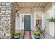 Inviting front entrance with stone accents, stylish door, and charming outdoor seating area at 4085 S Crystal Cir # 101, Aurora, CO 80014
