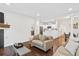 Bright open-concept living space with modern finishes, hardwood floors, and neutral decor at 4085 S Crystal Cir # 101, Aurora, CO 80014