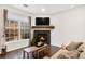 Inviting living room with cozy fireplace, large windows, and comfortable seating at 4085 S Crystal Cir # 101, Aurora, CO 80014
