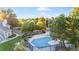 Aerial view of community pool surrounded by lush trees and well-maintained landscaping at 4085 S Crystal Cir # 101, Aurora, CO 80014
