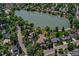Picturesque aerial view showcasing lush landscaping and a beautiful lake at 4790 W Lakeridge Rd, Denver, CO 80219