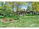 Beautifully landscaped backyard with large windows and a patio creating an idyllic setting for relaxation and outdoor enjoyment at 4790 W Lakeridge Rd, Denver, CO 80219