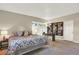Bedroom with lots of light from two big windows, and a built-in bookshelf at 4790 W Lakeridge Rd, Denver, CO 80219