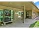 Cozy covered front porch with stylish decor and ample space for seating at 4790 W Lakeridge Rd, Denver, CO 80219