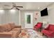 Cozy living room features a large sectional couch and outdoor access at 4790 W Lakeridge Rd, Denver, CO 80219