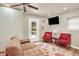 Cozy living room features a large sectional couch and outdoor access at 4790 W Lakeridge Rd, Denver, CO 80219