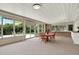Covered patio with ample seating and a stone counter, perfect for outdoor dining and entertainment at 4790 W Lakeridge Rd, Denver, CO 80219