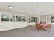 Covered patio featuring an outdoor dining space and a built-in counter with lots of storage under a large window at 4790 W Lakeridge Rd, Denver, CO 80219