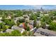 Aerial view of the residential area with a pool and tennis court in close proximity at 6929 E Briarwood Dr, Centennial, CO 80112