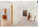 Bright interior featuring an open floor plan, brick fireplace, staircase, and easy access to the kitchen at 6929 E Briarwood Dr, Centennial, CO 80112