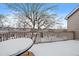 Balcony with railing overlooking the winter landscape, with outdoor seating covered in snow at 9875 Greensview Cir, Lone Tree, CO 80124