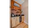 Stylish bar area with custom shelving and a wine cooler at 9875 Greensview Cir, Lone Tree, CO 80124