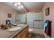 Clean bathroom with a shower/tub combination and updated fixtures at 9875 Greensview Cir, Lone Tree, CO 80124