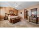 Bedroom featuring vaulted ceilings and an ensuite bathroom at 9875 Greensview Cir, Lone Tree, CO 80124