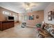 Bonus room with carpet, a ceiling fan, and natural light, perfect for relaxation or recreation at 9875 Greensview Cir, Lone Tree, CO 80124