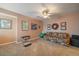 Bonus room with carpet, a ceiling fan, and natural light, perfect for relaxation or recreation at 9875 Greensview Cir, Lone Tree, CO 80124