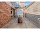 Inviting courtyard with brick accents, seating, and a large decorative pot at 9875 Greensview Cir, Lone Tree, CO 80124