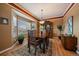 Elegant dining room with a large bay window and decorative accents at 9875 Greensview Cir, Lone Tree, CO 80124