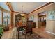 Bright dining area with a large window and view to the kitchen at 9875 Greensview Cir, Lone Tree, CO 80124