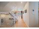 Hallway with wood floors and a staircase leading to an upper level at 9875 Greensview Cir, Lone Tree, CO 80124