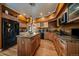 Spacious kitchen with granite countertops and wood cabinetry at 9875 Greensview Cir, Lone Tree, CO 80124