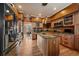 Spacious kitchen featuring a large island, stainless steel appliances, and ample cabinet space at 9875 Greensview Cir, Lone Tree, CO 80124