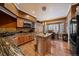 Kitchen boasts granite countertops, an island, and modern appliances at 9875 Greensview Cir, Lone Tree, CO 80124