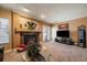 Spacious living room featuring a fireplace and plenty of natural light at 9875 Greensview Cir, Lone Tree, CO 80124