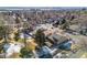 Aerial view of house and neighborhood, showcasing surrounding homes and landscape at 12224 E Amherst Cir, Aurora, CO 80014