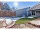 Small backyard with artificial turf and patio at 12224 E Amherst Cir, Aurora, CO 80014