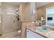 Bathroom with a walk-in shower and glass vessel sink at 12224 E Amherst Cir, Aurora, CO 80014