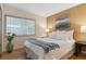 Cozy bedroom with hardwood floors and large window at 12224 E Amherst Cir, Aurora, CO 80014