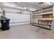 Attached garage with ample storage space and epoxy flooring at 12224 E Amherst Cir, Aurora, CO 80014