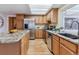 Spacious kitchen featuring granite countertops and stainless steel appliances at 12224 E Amherst Cir, Aurora, CO 80014