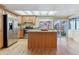 Kitchen with island, granite counters and stainless steel appliances at 12224 E Amherst Cir, Aurora, CO 80014