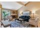 Vaulted ceiling living room with hardwood floors and fireplace at 12224 E Amherst Cir, Aurora, CO 80014