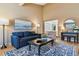 Living room featuring hardwood floors and comfortable seating at 12224 E Amherst Cir, Aurora, CO 80014