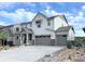 Charming two-story home with a three-car garage and inviting covered front porch at 3955 Descent St, Castle Rock, CO 80108