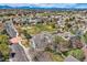 A neighborhood aerial view with a green park and residential homes and landscaping at 11638 Xavier Way, Westminster, CO 80031