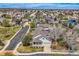 Wide aerial shot displaying the house, surrounding neighborhood, and well-maintained street at 11638 Xavier Way, Westminster, CO 80031
