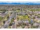 A birds-eye of a neighborhood featuring a park, green space, and mountain views at 11638 Xavier Way, Westminster, CO 80031